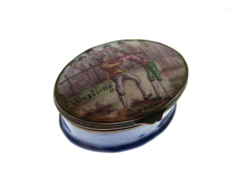 19th Century enamel oval patch box, the hinged cover with a scene of two figures and the title 'Wrestling', with onlookers  