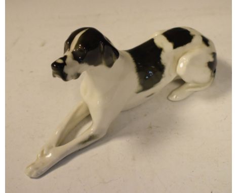 Ceramic figure of a pointer in recumbent position, 29cm long  
