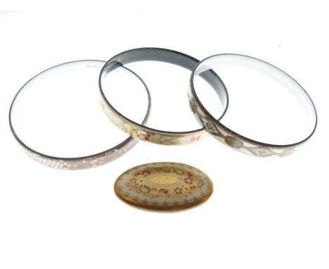 Four Michaela Frey enamel decorated bangles and an oval brooch  