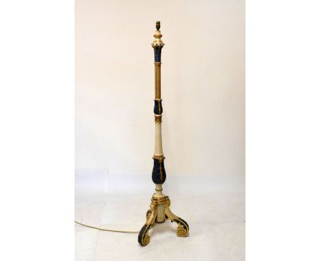 Polychrome decorated beech standard lamp having carved acanthus and fluted column, raised on scrolling tripod base with shade