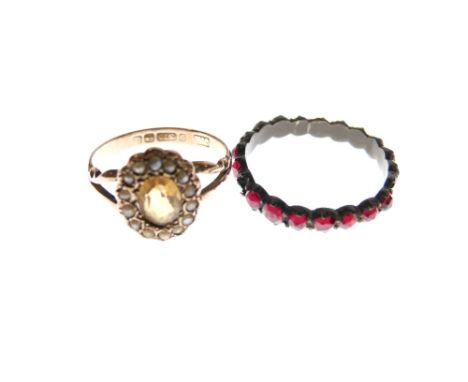 9ct gold dress ring set orange stone with seed pearl border, size N, 1911, together with a garnet set eternity ring, size R  