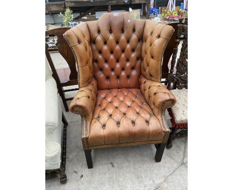 A GEORGE III STYLE WINGED BUTTON BACK LEATHER CHAIR 