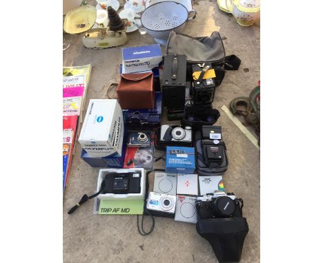 AN ASSORTMENT OF CAMERA EQUIPMENT TO INCLUDE VARIOUS OLYMPUS CAMERAS ETC 