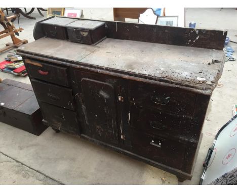 A LARGE VINTAGE WORK BENCH WITH EIGHT DRAWERS AND STORAGE CUPBOARD 