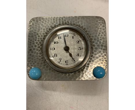 AN ARTS AND CRAFTS STYLE PEWTER MANTEL CLOCK 