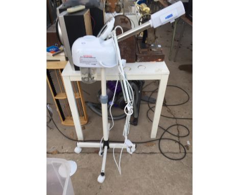 A HOT VAPOUR WATER TANK AND A CLAMP MIGNIFYING LAMP 
