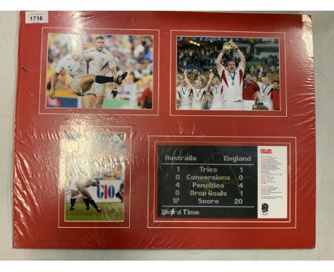 THREE MOUNTED COLOUR PHOTOGRAPHS OF JONNY WILKINSON AND SOME OF THE WINNING ENGLAND RUGBY TEAM AT THE WORLD CUP.  TO ALSO INC