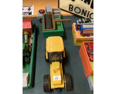 A YELLOW WOODEN TRACTOR WITH PLASTIC CAB, WOODEN TRAILER, FLAT ROLLER AND A WOODEN LAND ROVER DEFENDER 