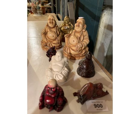 EIGHT CERAMIC BUDDHA ORNAMENTS OF VARYING SIZES 