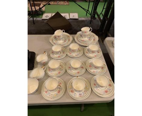 AN ASSORTMENT OF CERAMIC WARE TO INCLUDE TEN MATCHING TRIOS AND FURTHER CUPS AND PLATES ETC 