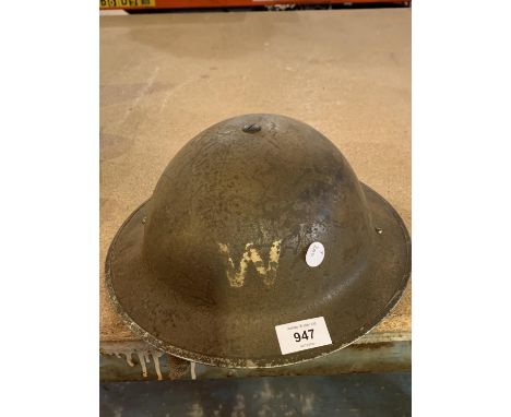 A VINTAGE TIN ARMY HELMET 