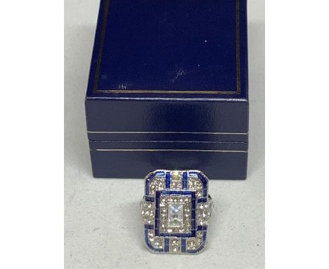 A LARGE RECTANGULAR ART DECO STYLE DRESS RING WITH BLUE AND CLEAR STONES SIZE L WEIGHT 12.7G WITH A PRESENTATION BOX 