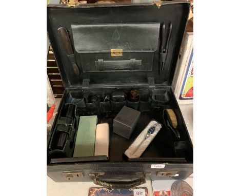 A VINTAGE MOBILE BARBERS CASE CONTAINING HAIRDRESSERS ACCESSORIES 