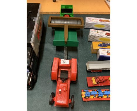A RED WOODEN TRACTOR WITH WOODEN TRAILER, FLAT ROLLER AND A WOODEN CABLESS LAND ROVER 