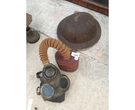 A VINTAGE GAS MASK AND A FURTHER TIN ARMY HELMET 