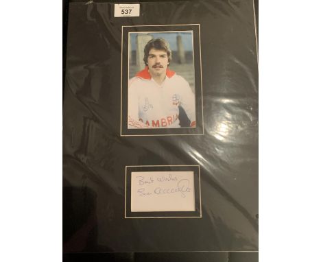 A PICTURE OF SAM ALLARDYCE PLAYING FOR BOLTON 1978 WITH HIS AUTOGRAPH IN A MOUNT COMPLETE WITH A CERTIFICATE OF AUTHENTICITY 
