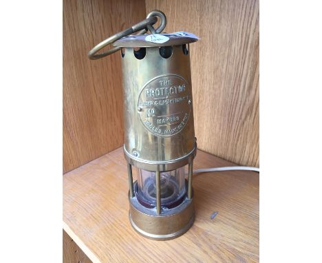 AN ELECTRIC BRASS LAMP 'THE PROTECTOR' 