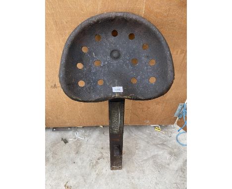 A VINTAGE LISTER TRACTOR/IMPLEMENT SEAT WITH MOUNTING BRACKET 