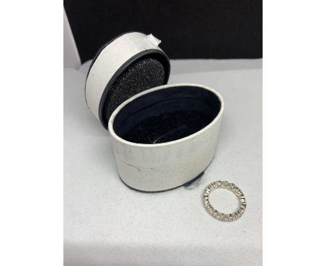 A SILVER RING WITH HEART SHAPED AND CIRCULAR CLEAR STONES IN A PRESENTATION BOX SIZE N 
