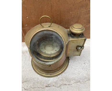 A VINTAGE SESTREL MARITIME COMPASS IN A BRASS CASE WITH BRASS SIDE COMPARTMENT FOR OIL LAMP 