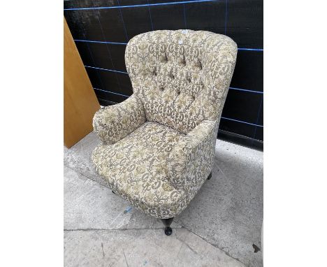 A MODERN BUTTON-BACK EASY CHAIR ON FRONT CABRIOLE LEGS 