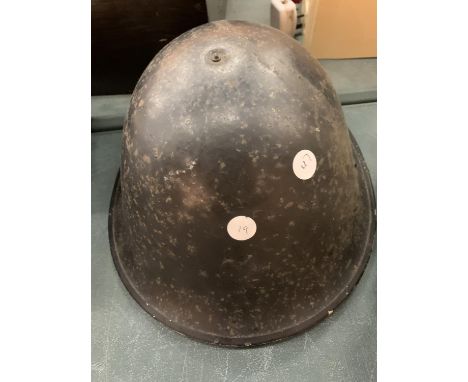 A VINTAGE TIN ARMY HELMET 