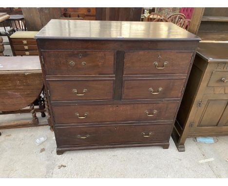 A GEORGE III OAK CHEST OF DRAWERS ON BRACKET FEET, 41" WIDE, THE TOP FOUR DRAWERS CONVERTED TO TWO DOOR CUPBOARD 