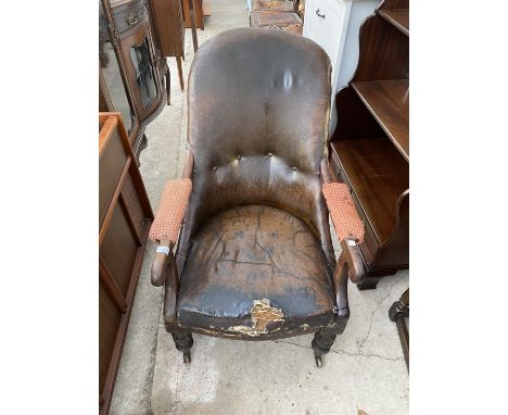 A 19TH CENTURY MAHOGANY FRAMED BUTTON-BACK FIRESIDE CHAIR 