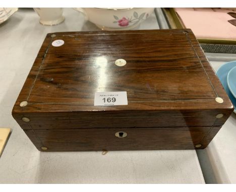 A VINTAGE WOODEN HINGED BOX WITH MOTHER OF PEARL EMBELLISHMENT 