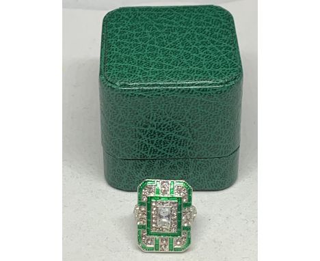 A LARGE RECTANGULAR ART DECO STYLE DRESS RING WITH GREEN AND CLEAR STONES SIZE N 1/2 WEIGHT 12.14G WITH A PRESENTATION BOX 