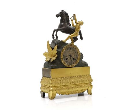 A French gilt metal mantel clock,  19th century, the circular dial surmounted by figure and rearing horse, on a leaf decorate