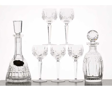 A Waterford 'Kylemore' pattern crystal glass suite c.1970, comprising two decanters, one with a silver whisky label, 31.2 and