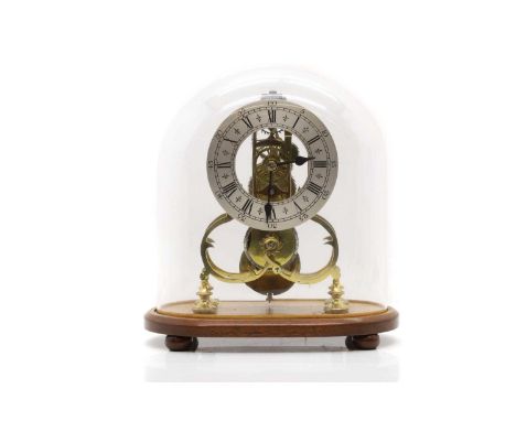 A brass skeleton clock, late 19th to early 20th century, the silvered chapter ring with Roman numerals under a glass dome,31c