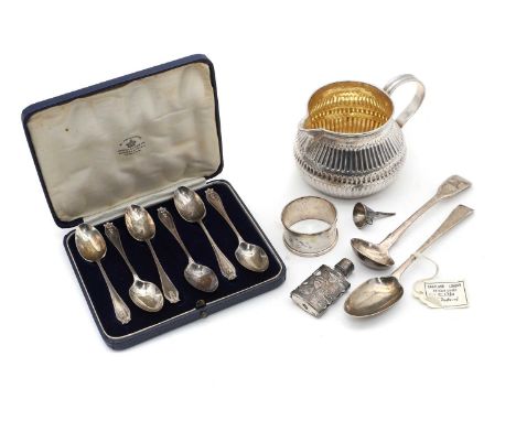 A collection of silver items, comprising a jug of squat form, with silver gilt interior, London 1819 13cm wide, a small Georg