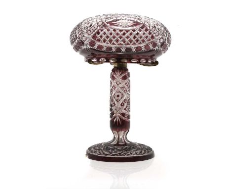 A cased glass lamp, first half 20th century, of mushroom form with amethyst colouring, with star cut motifs43cm highCondition