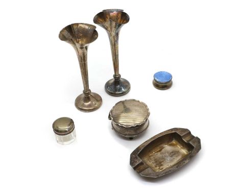 A group of silver items comprising a pair of bud vases, Sheffield 1919, on weighted bases, 14.5cm high, three dressing table 