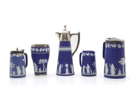 A collection of blue and white Jasperware,  late 19th century, comprising, four jugs, two with silver plated mounts, one with