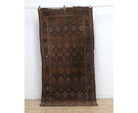 A Bokhara rug 20th century, 120 x 255cmCondition ReportUsed and with wear.