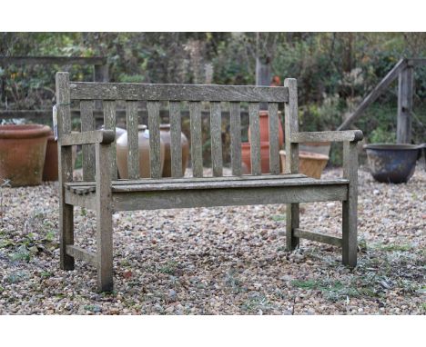 A teak garden bench 20th century, 119cm wide 55cm deep83cm high, seat 38cmCondition ReportUsed, weathered.