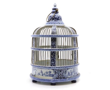 A Delft pottery birdcage  late 19th century, the dome top with stepped finial, the whole having foliate painted decoration wi