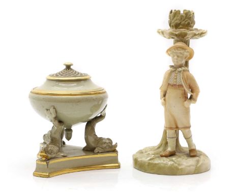 A Royal Worcester porcelain figural candlestick 19th century, modelled as a young boy, printed and impressed marks, 20cm high