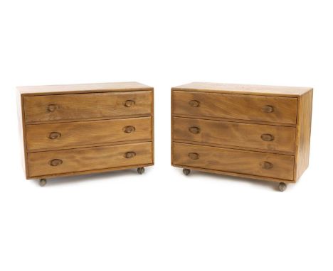 A pair of Ercol 'Windsor' chest of drawers, c.1960s, designed by Lucian Ercolani, Model 483 commode in blonde elm, with three