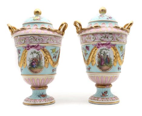 A pair of Dresden porcelain urns and covers late 19th century, the cylindrical urns with domed covers, having a turquoise gro