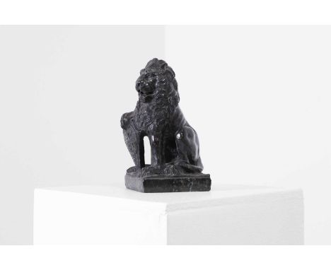 A hardstone model of a lion 20th century, modelled recumbant on plinth base,9.5cm wide7.5cm deep16cm highProvenance: The prop