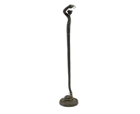 A 'La Tentation' design floor lamp after Edgar Brandt, the dish form mottled glass shade raised on a 'bronzed' snake form sup