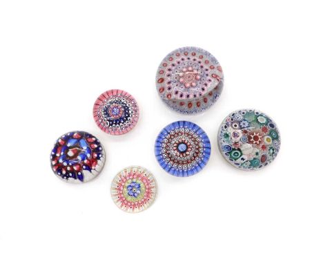 A group of six Old English type glass paperweights,  19th century and later, comprising a large concentric paperweight, possi