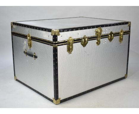 A Large Banded Aluminium Travelling Trunk, 99x76.5x63.5cm