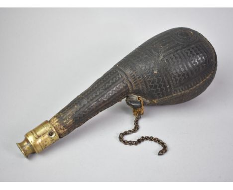 A Bedouin Camel Scrotum Powder Flask with Brass Nozzle and Geometric Decoration, 23cms Long