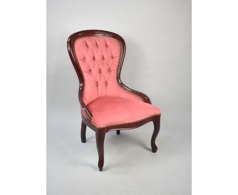 A Reproduction Victorian Mahogany Framed Ladies Chair with Pink Upholstery and Button Back