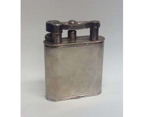A massive Dunhill lighter of typical design. Approx. 384 grams. Est. £250 - £350.